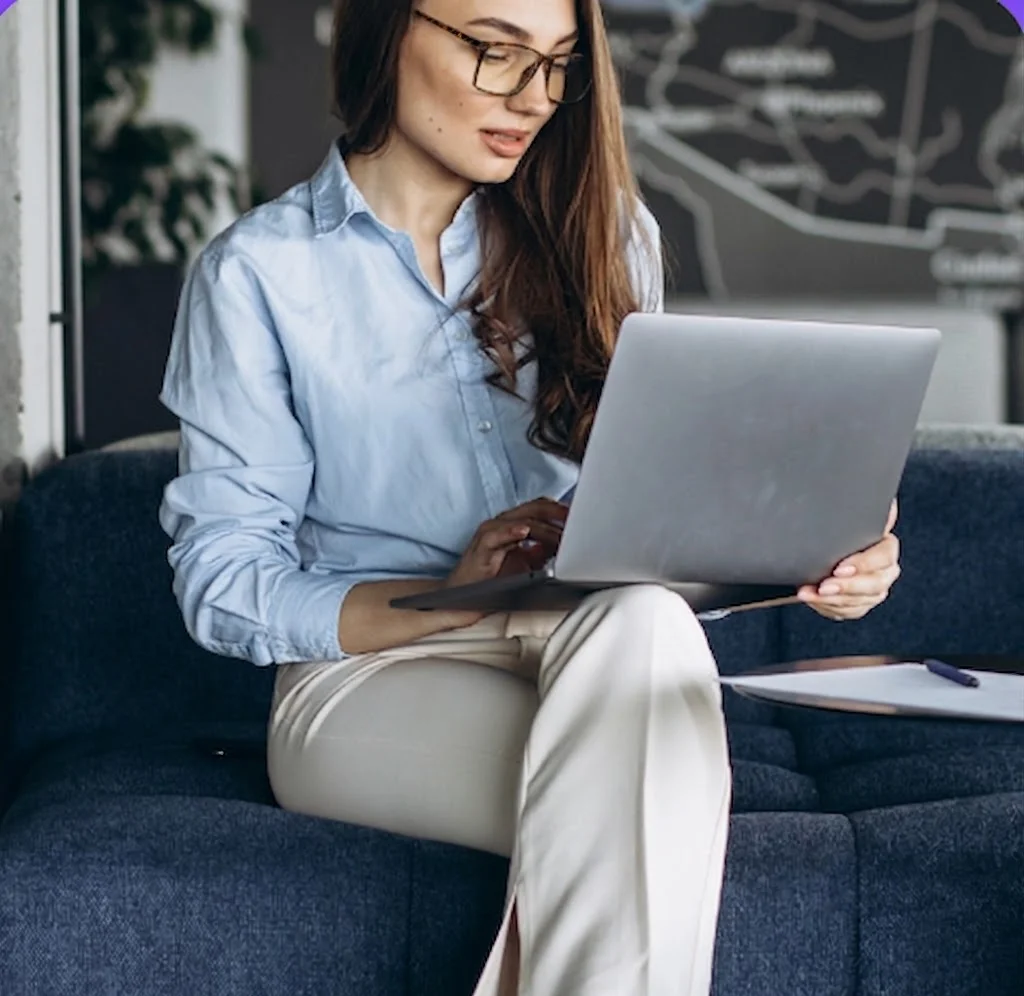 Editor working on a laptop on a sofa